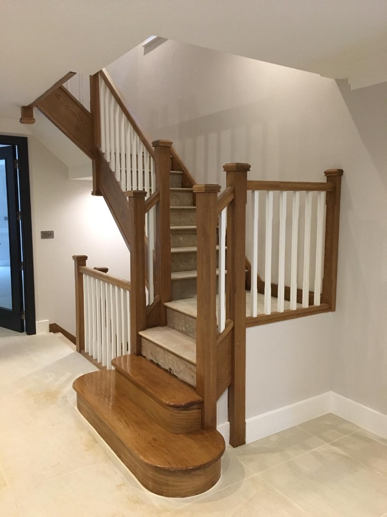 Crafted wooden staircase with white balustrades